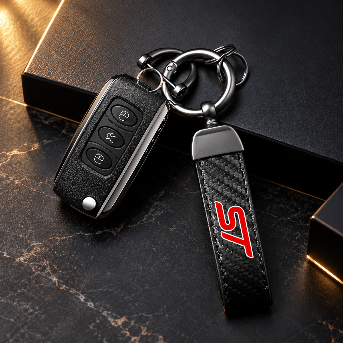 Black quick-release keychain beside a car remote
