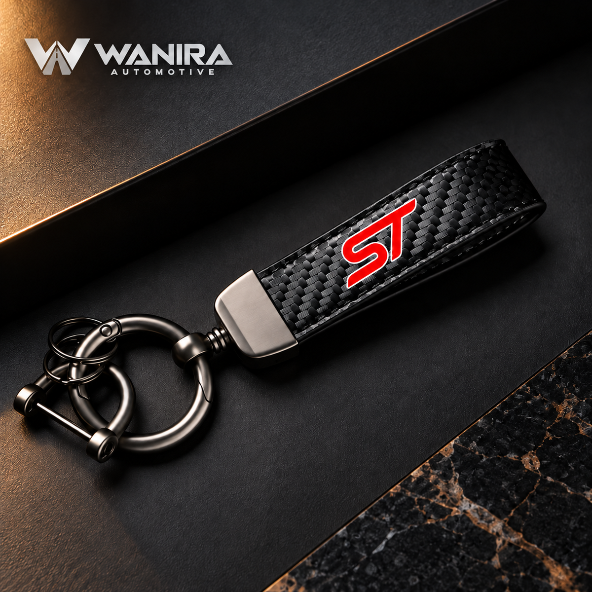 WANIRA branded black carbon-fiber-pattern quick-release keychain with red ST-style emblem