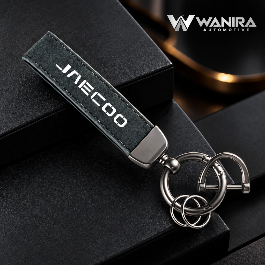 Grey suede-style automotive keychain with WANIRA Automotive branding