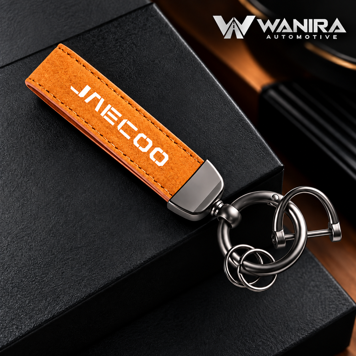 Tan suede-style automotive keychain with WANIRA Automotive branding