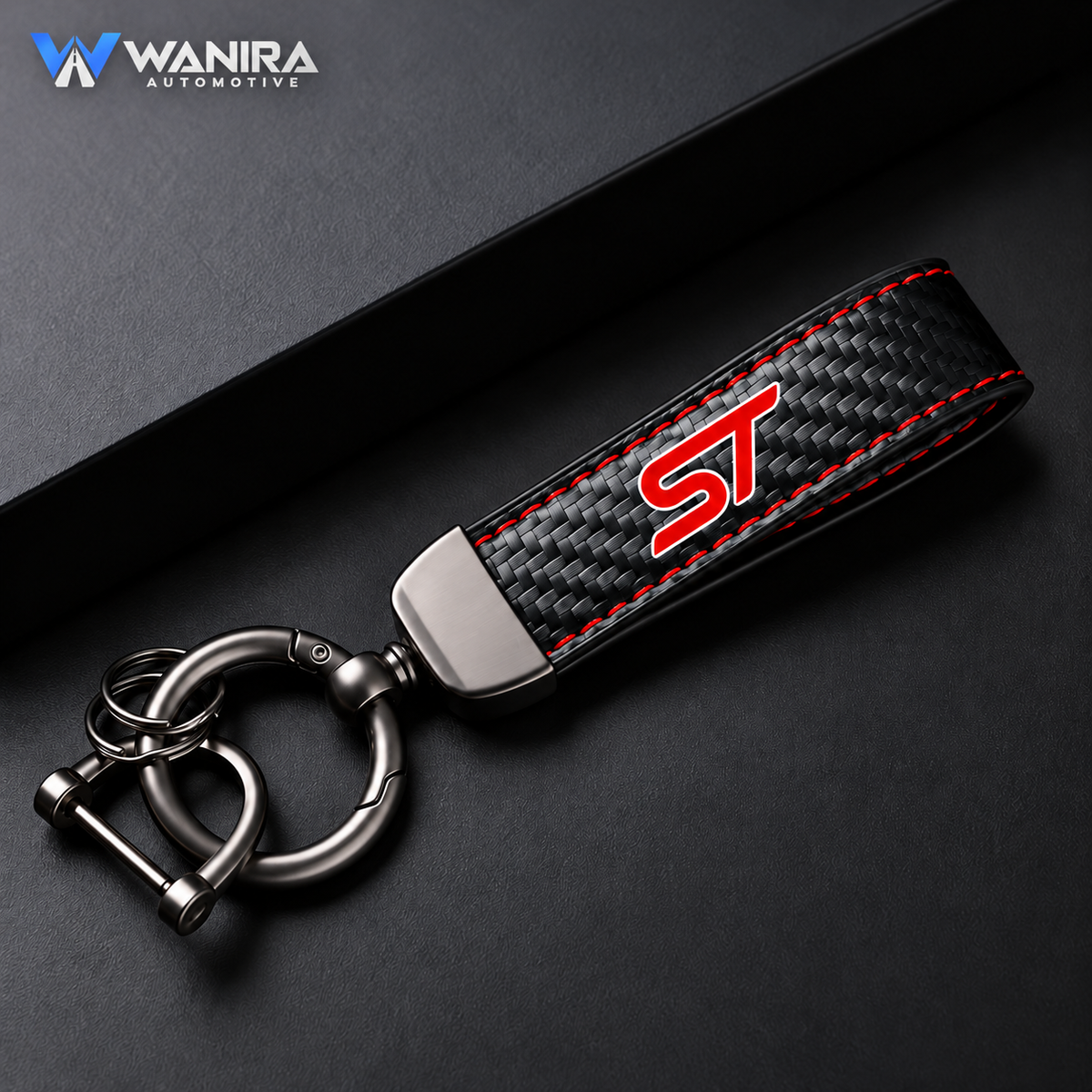 WANIRA single black carbon-fiber-pattern keychain with red stitching and ST emblem